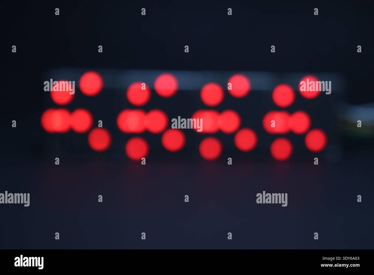 Patterns of light formed on an LED matrix display by defocusing Stock Photo