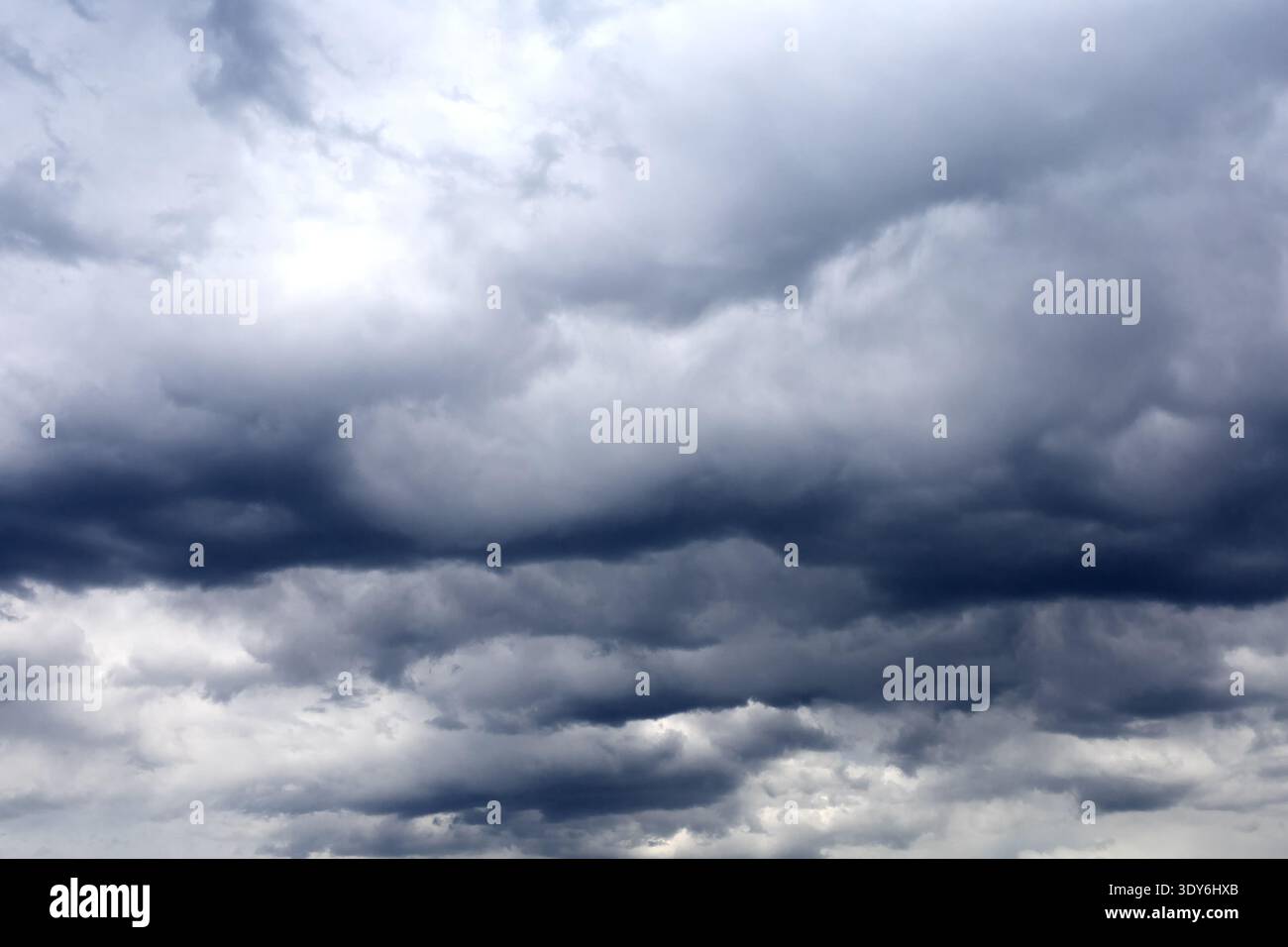 Dark cloudy sky. Gloomy heaven cloudscape. Nature dramatic skyscape background Stock Photo