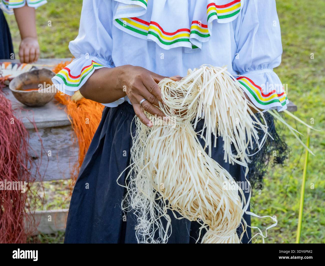 Women from Minga Peru demonstrate basket weaving techniques in Amazonas, Peru during a community event Stock Photo