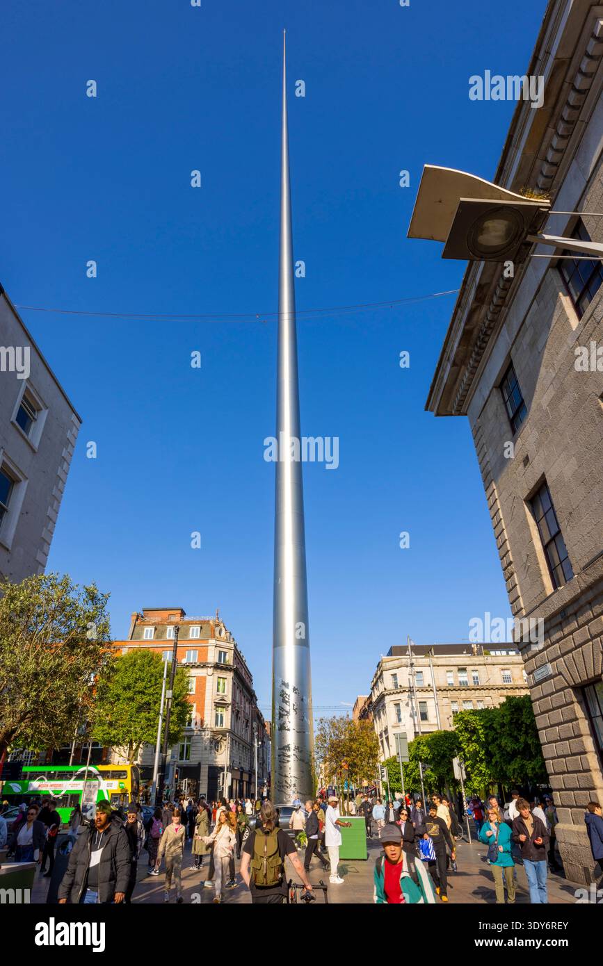 Visitors gather around the Spire of Dublin in the city center during a clear day in springtime Stock Photo