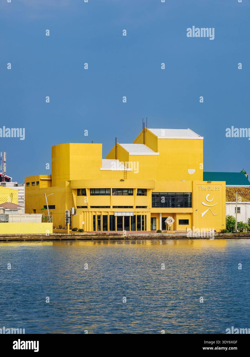 View of The Bliss Institute in Belize City with calm waters and clear skies in the background Stock Photo