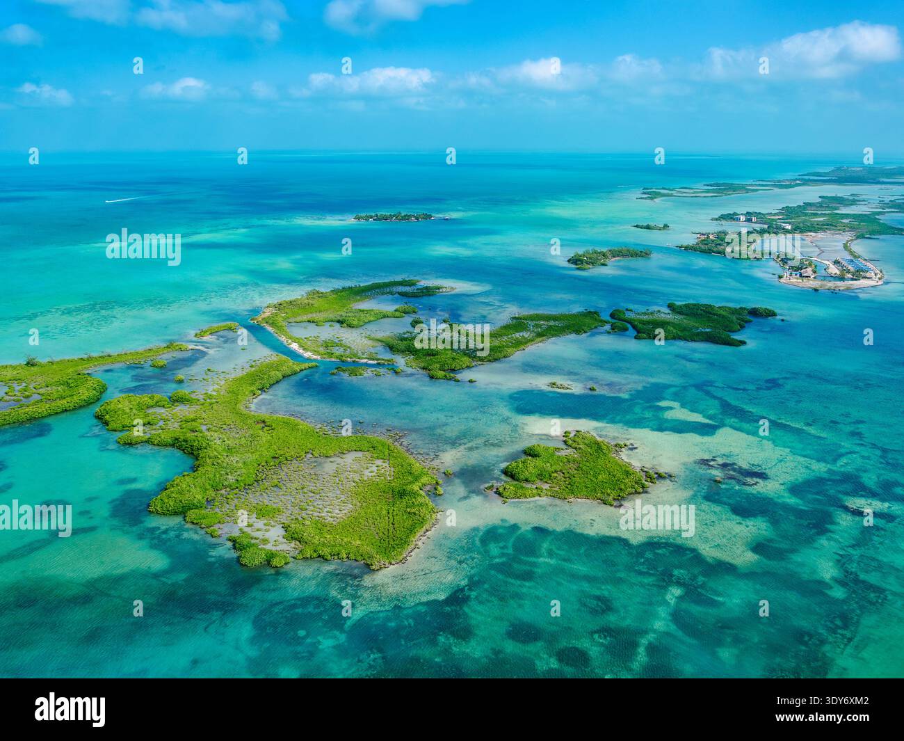 View of Ambergris Caye showing land and water with clear skies and blue tones in Belize District of Belize Stock Photo