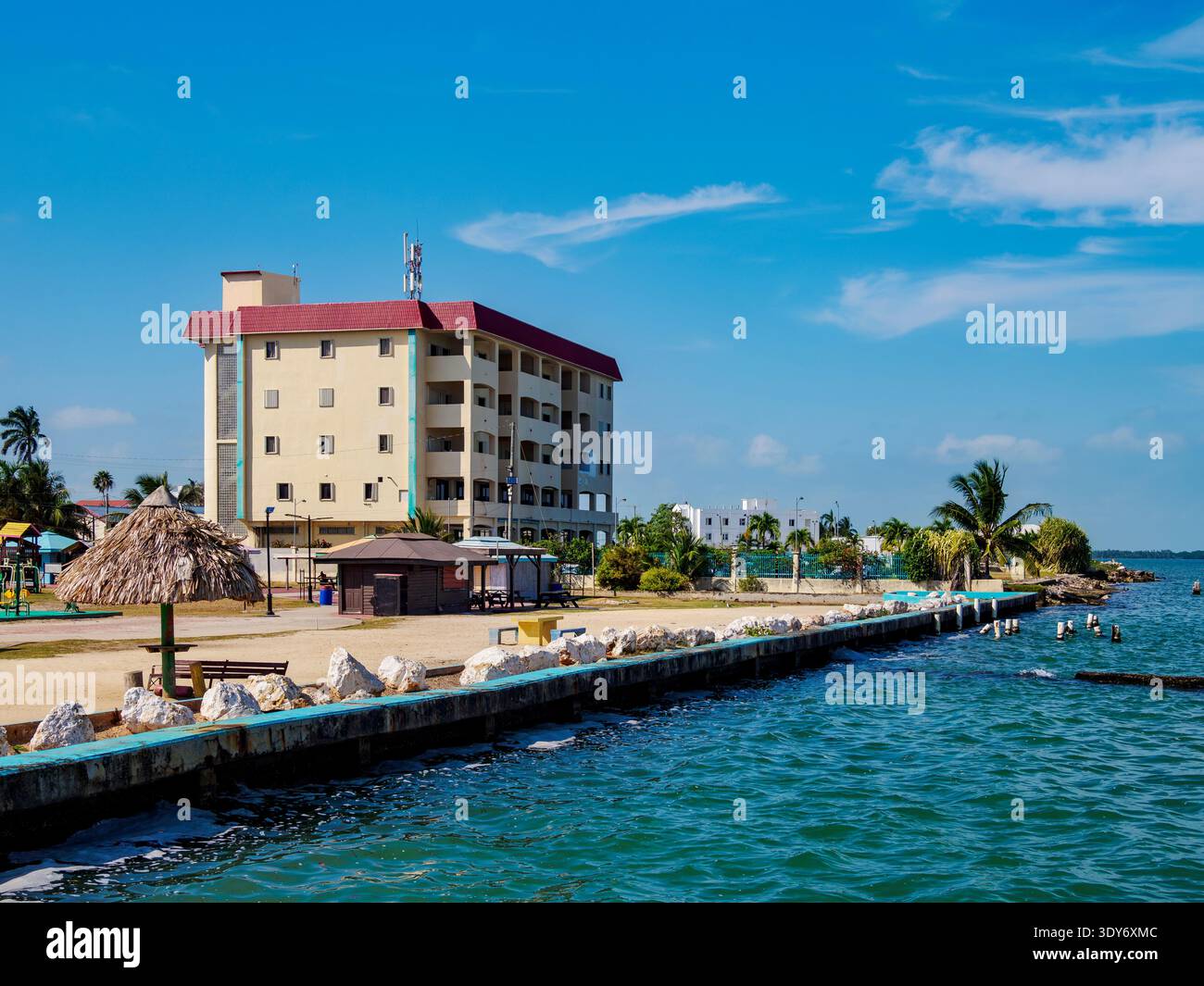 Visit to BTL North Side Digi Park in Belize City with clear skies and a calm waterside area Stock Photo