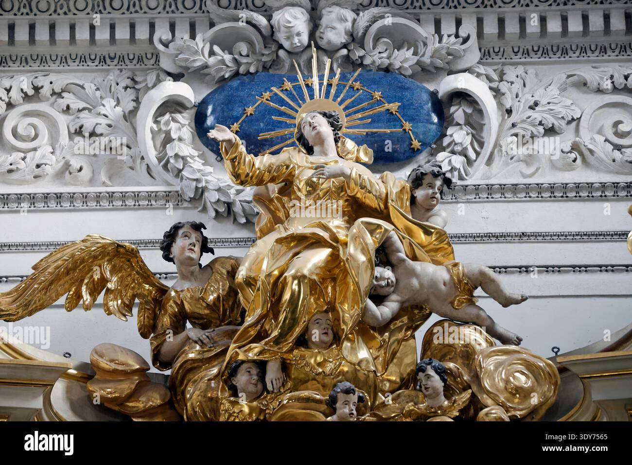 Statue of Assumption of Mary surrounded by figures in Visitationist Church in Warsaw Stock Photo