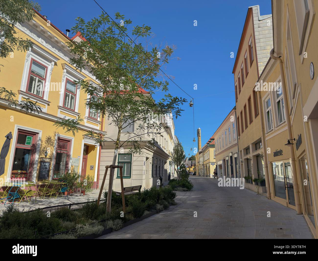 Exploring historic Altgasse in Hietzing with new pathways and buildings under blue sky in Vienna, Austria Stock Photo