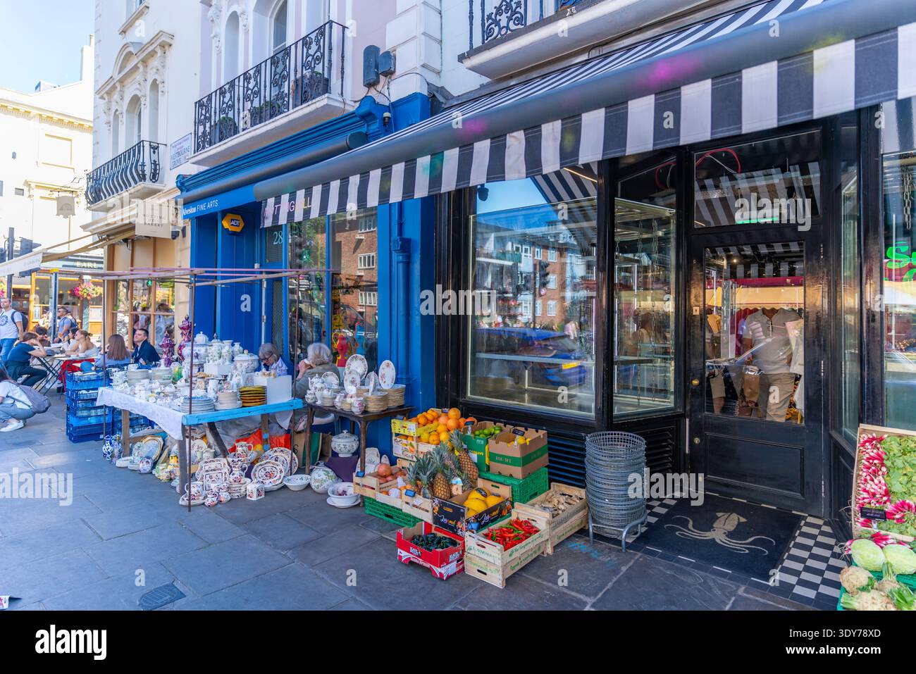 Colorful shops attract visitors and shoppers on Portobello Road during summer in Kensington, London, England Stock Photo
