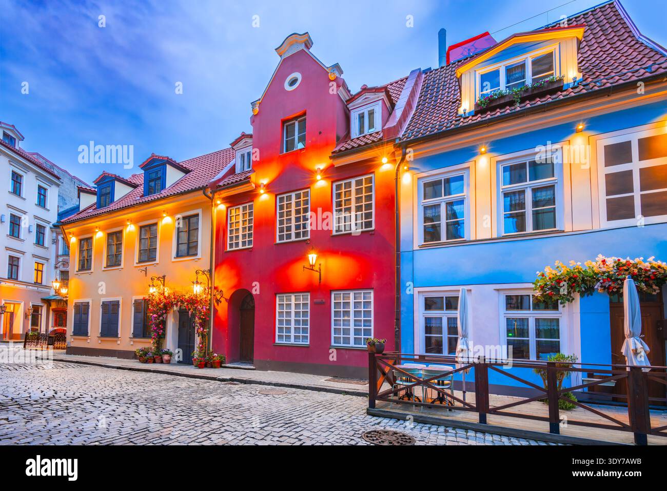 Riga, Letonia - 05th June 2025. Midnight city lights, street cafes in historical downtown. Stock Photo