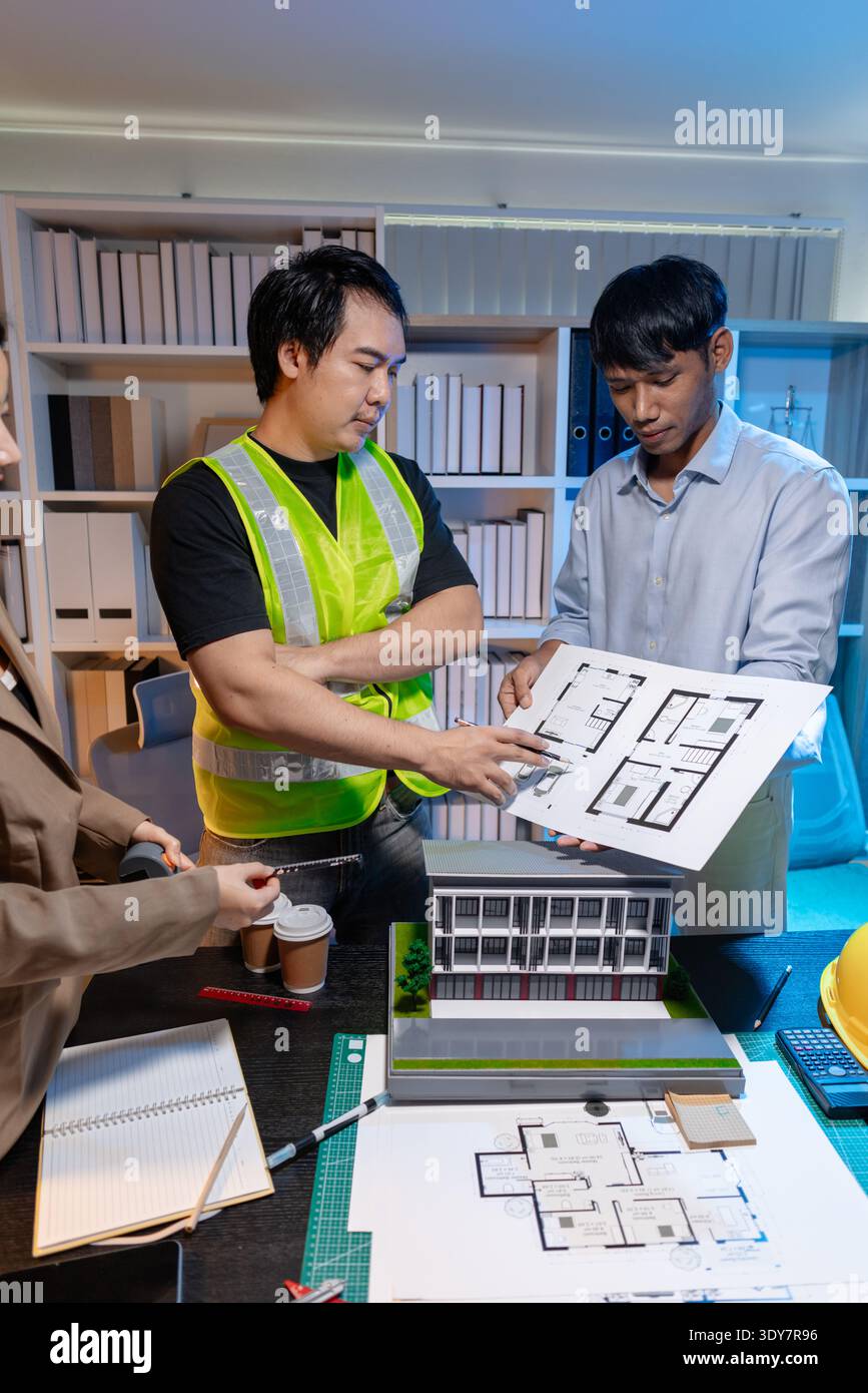 Architects and engineers meet to plan modern construction projects ...