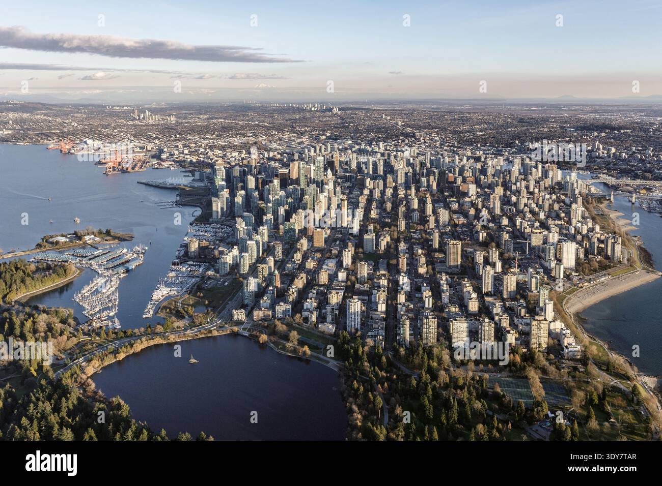 Aerial view of downtown Vancouver with Stanley Park, Burrard Inlet, and ...