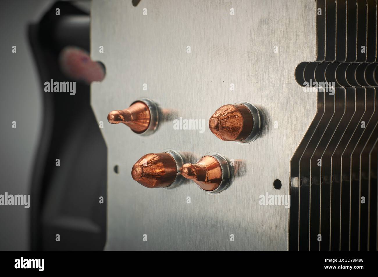 brushed silver metal fins and copper heat pipes of cpu cooler, computer hardware component, pc building background concept, closeup soft focus Stock Photo