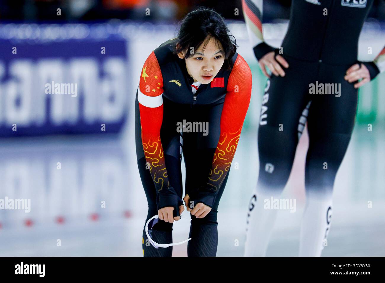 Shihui Yu of China looks exhausted after competing on the Women's 500m ...