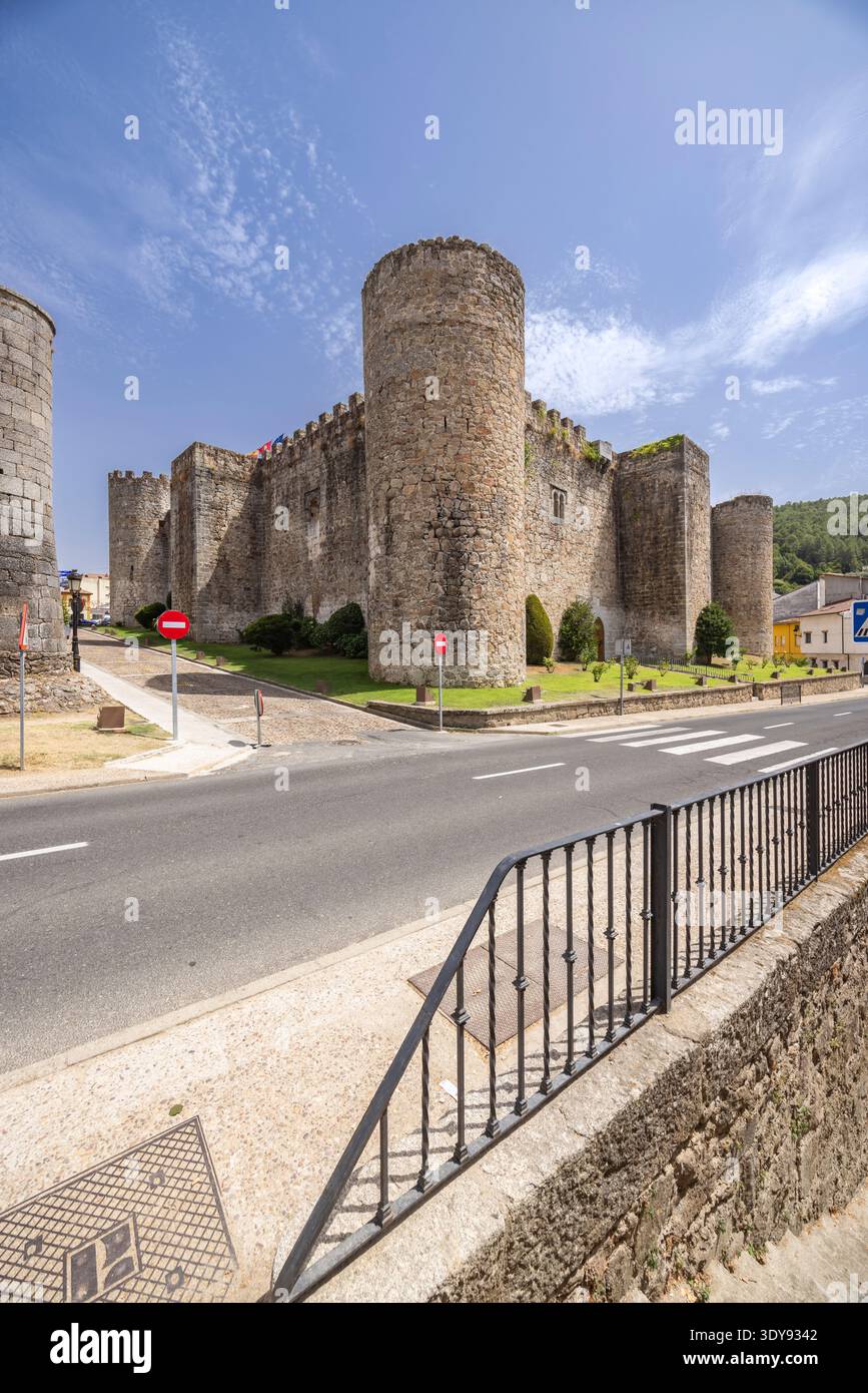 Historic castle with round towers and battlements facing a road under a ...