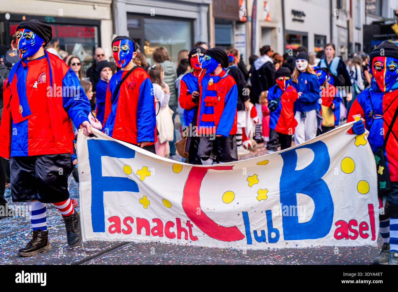Basel, Switzerland - 25 March 2026: Children wearing colorful masks and ...
