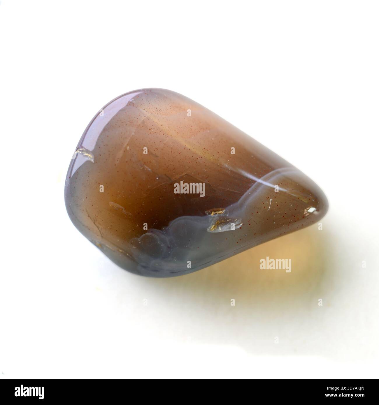 Banded agate from Botswana. Agate is a banded variety of chalcedony. Agate stones are characterised by alternating bands of different coloured chalcedony and sometimes include macroscopic quartz. Stock Photo