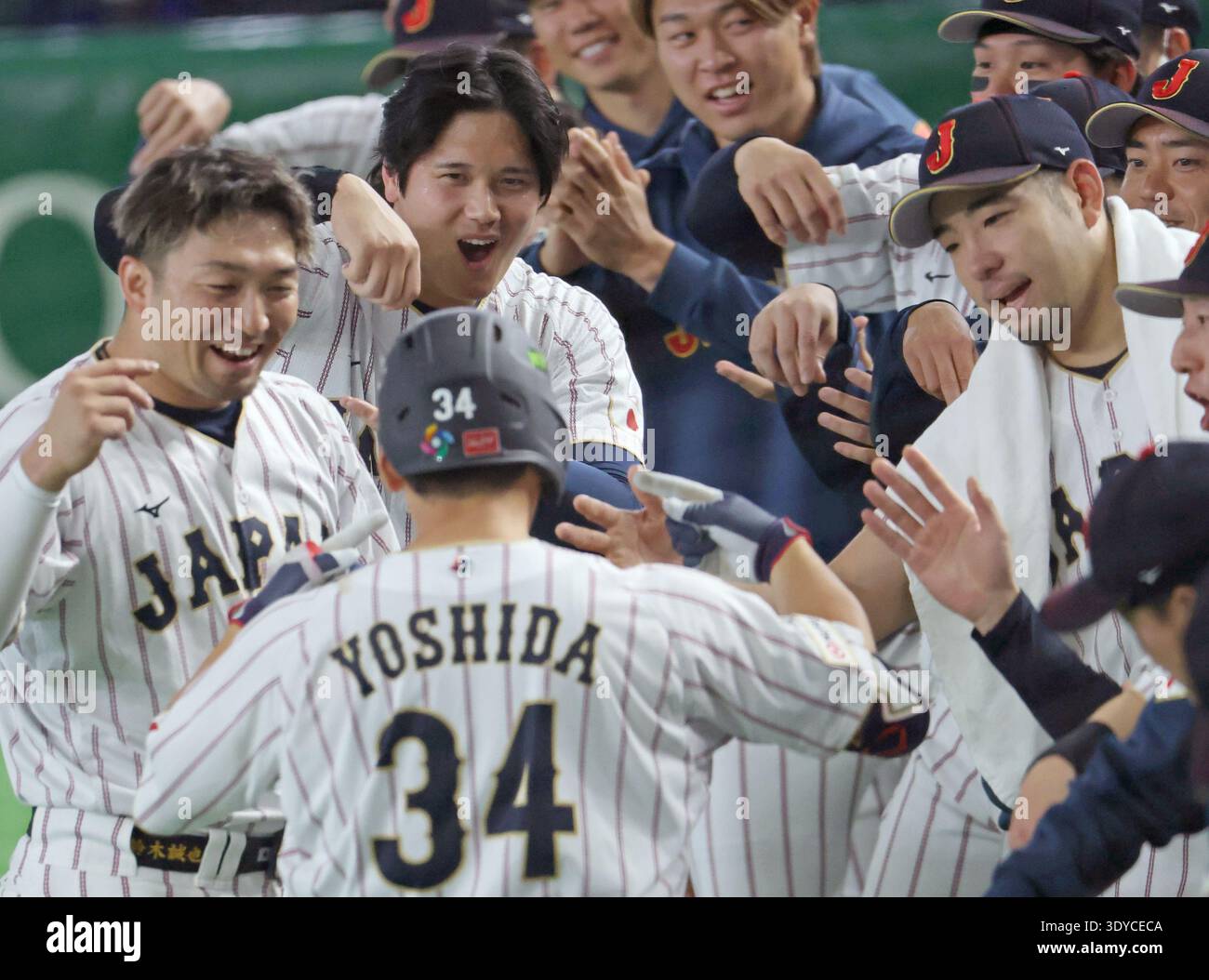 Masataka Yoshida of Japan is celebrated after hitting a home run in the ...