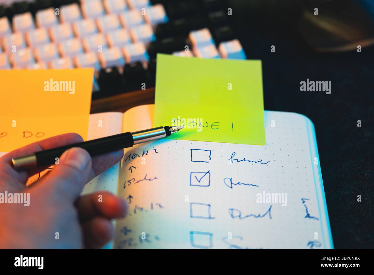 Checklist notebook completed task sticky note DONE. Hand pointing finished task checkmark productivity progress tracking organization workflow plannin Stock Photo