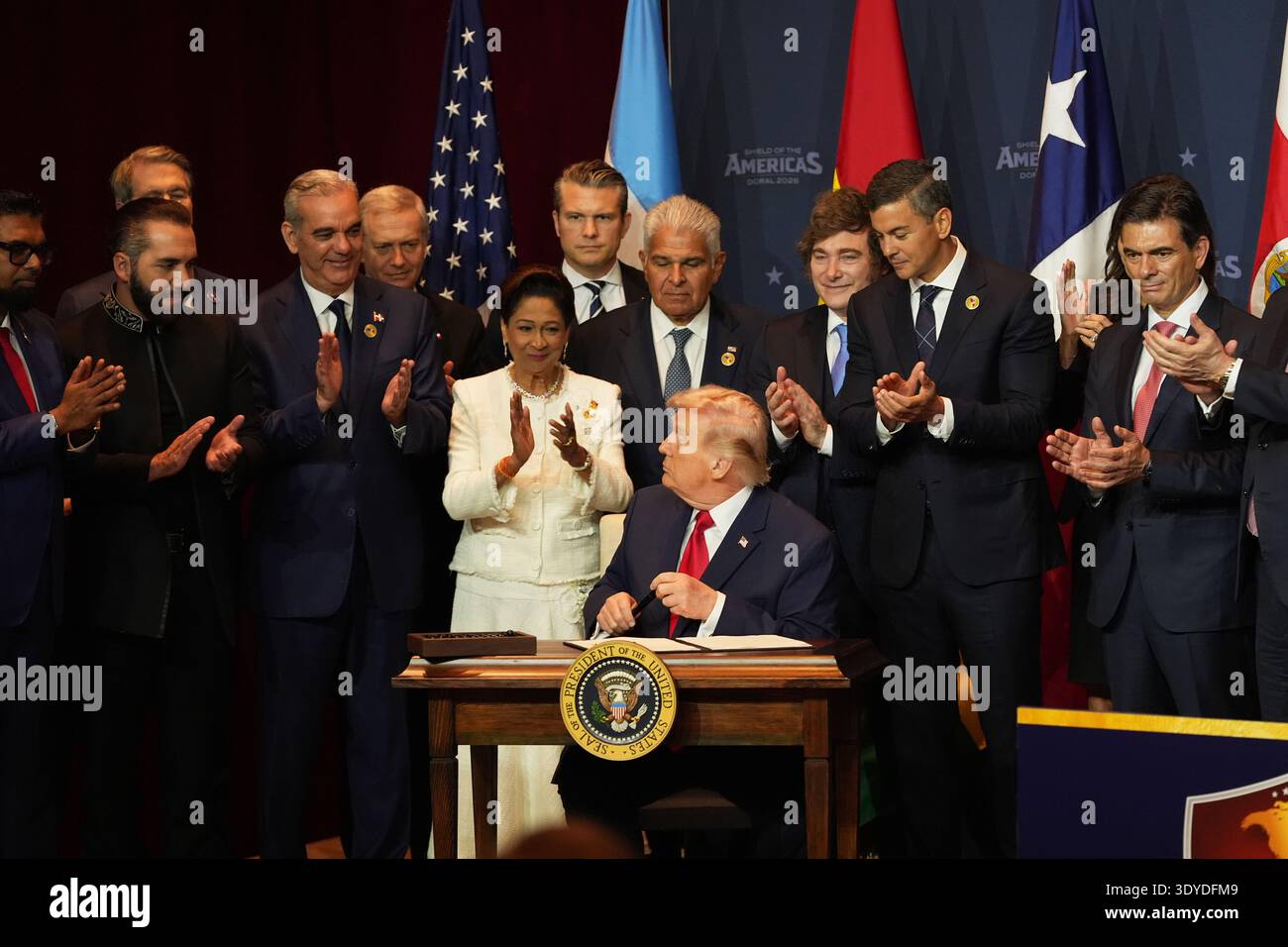 President Donald Trump hands out pens after signing a proclamation ...