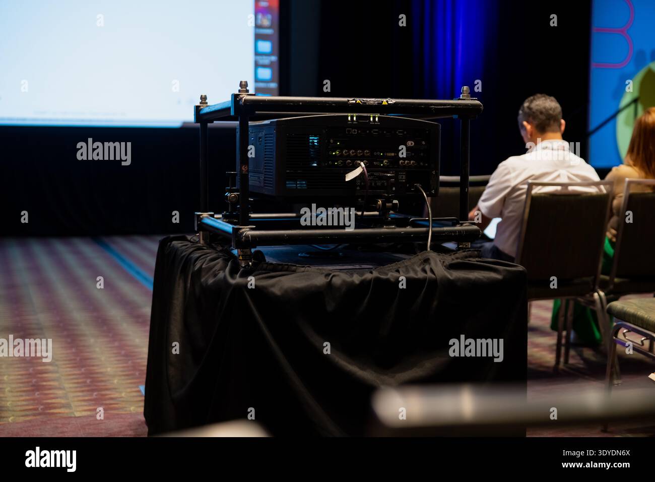 Conference Room Rack Rear Audio visual control rack on a draped table in a conference room with ...