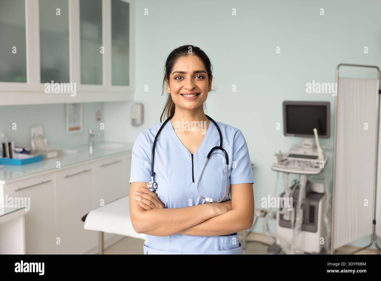 Woman in blue medical scrubs hi-res stock photography and images - Alamy