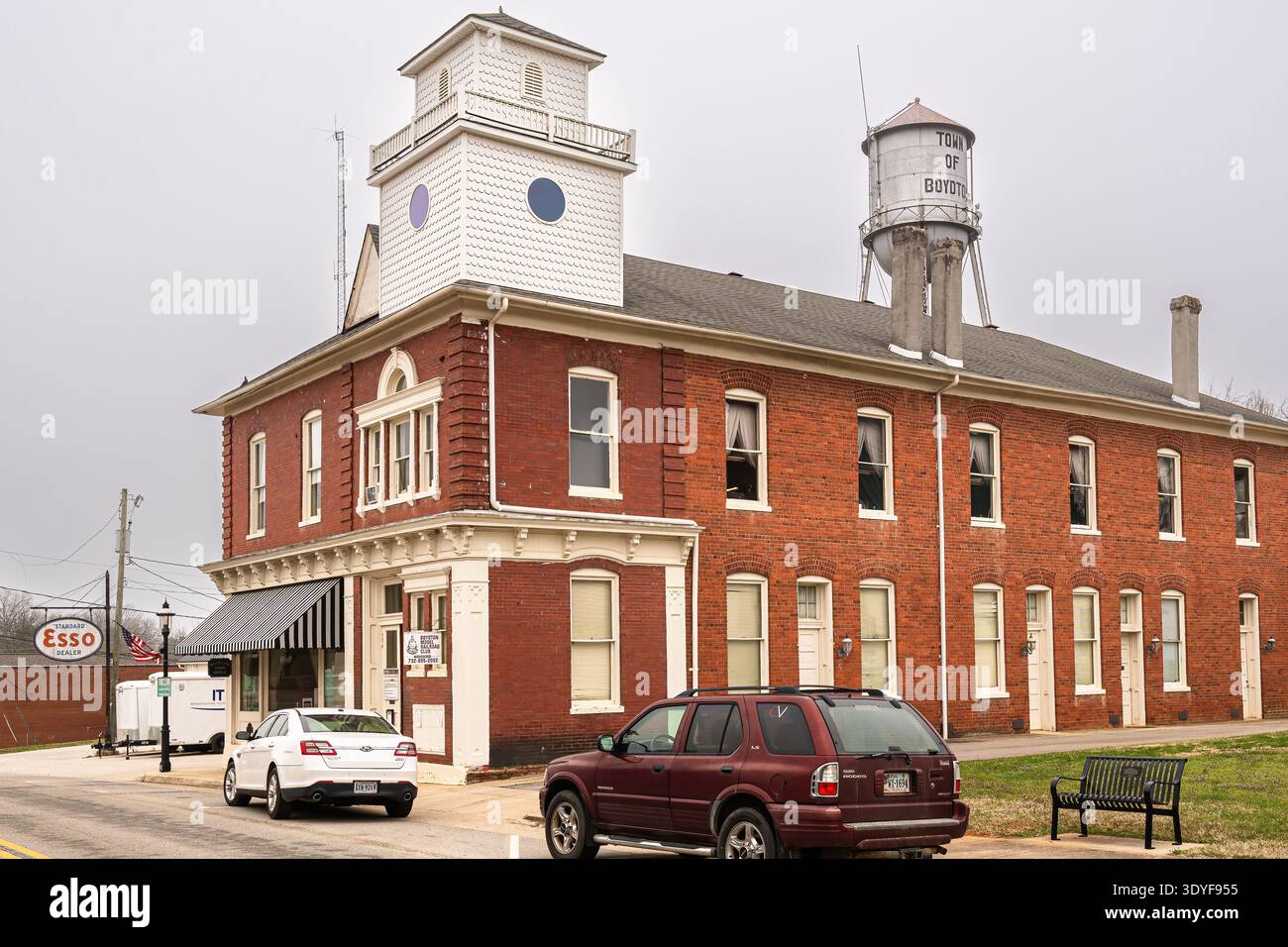 Boydton, Virginia, USA : Historic brick civic building with the Town of Boydton water tower rising behind it in the rural courthouse town. Stock Photo