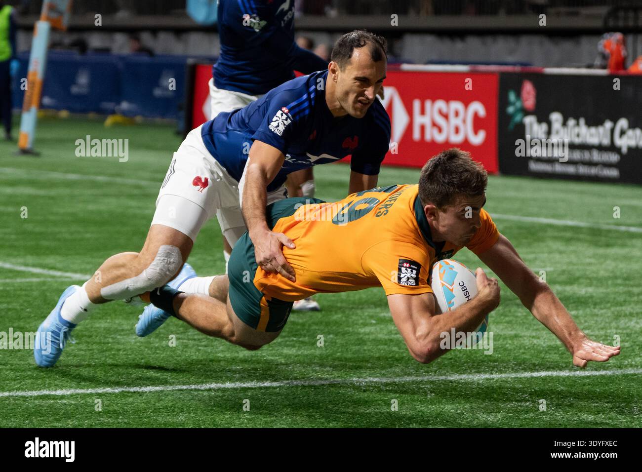 Australia's Archer Saunders (49) scores a try while France's Paulin ...