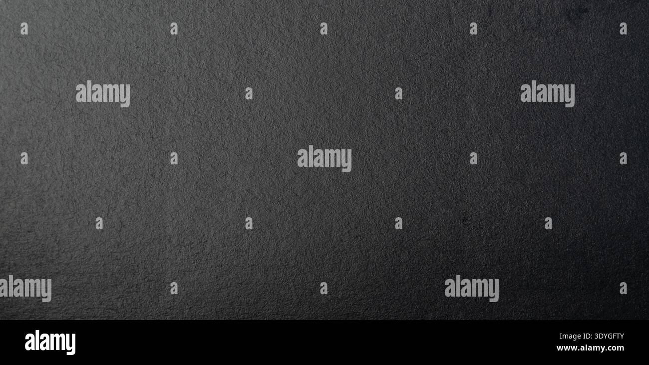 Black matte paper surface plain material with gradient light close up  macro view Stock Photo