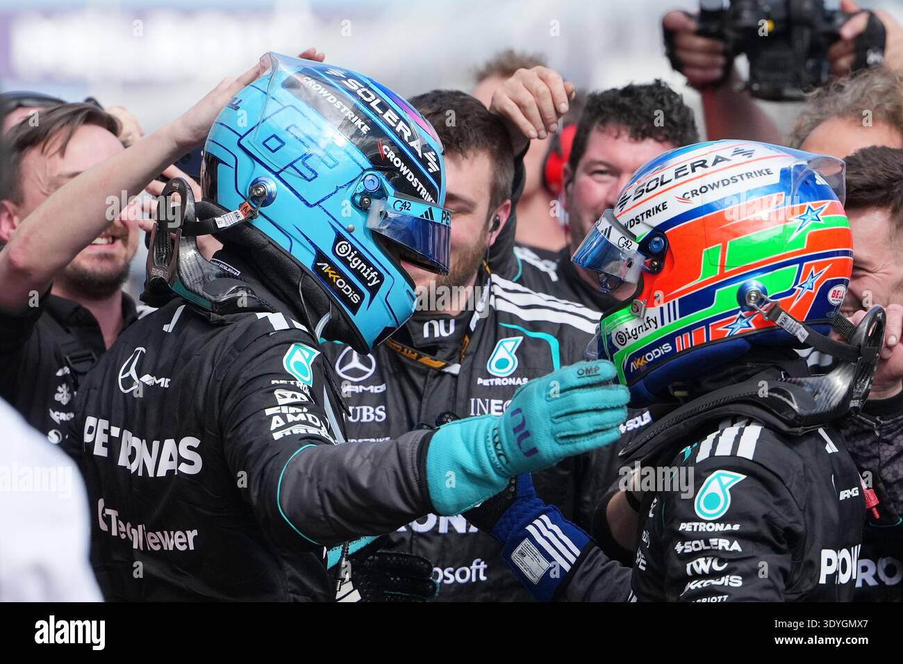 mercedes-driver-george-russell-left-of-britain-embraces-teammate
