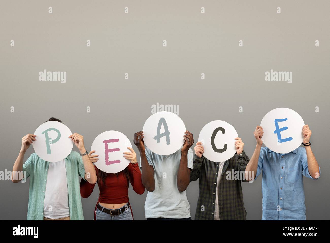 Multicultural group holding round hi-res stock photography and images ...