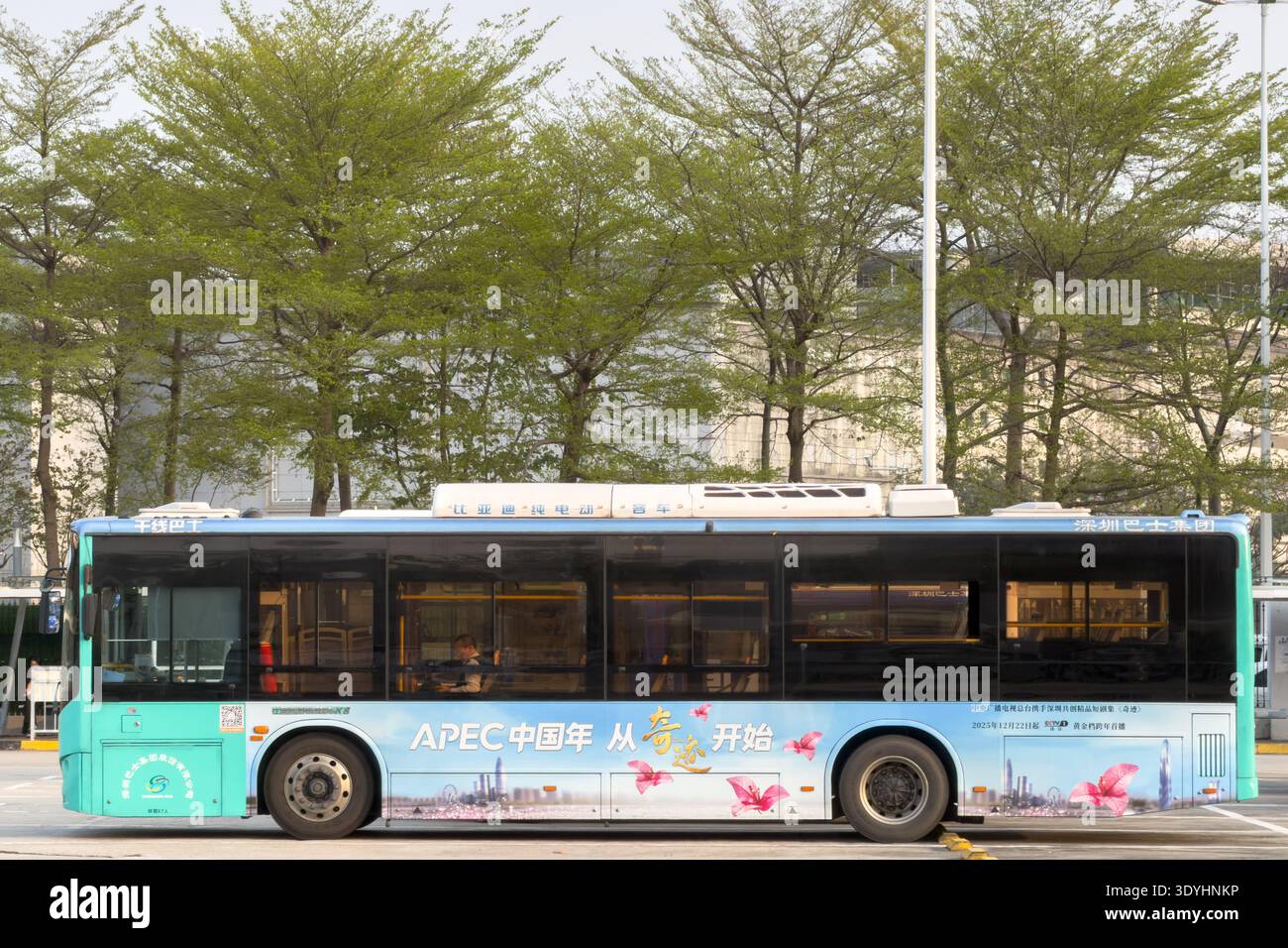 View of a public bus with APEC 2026 China advertisement on March 7 ...