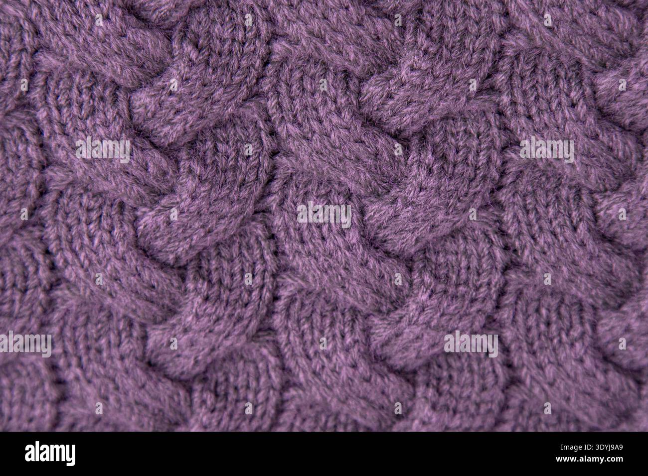 Pink cable Knit Fabric wool sweater background. Knitted texture Stock Photo