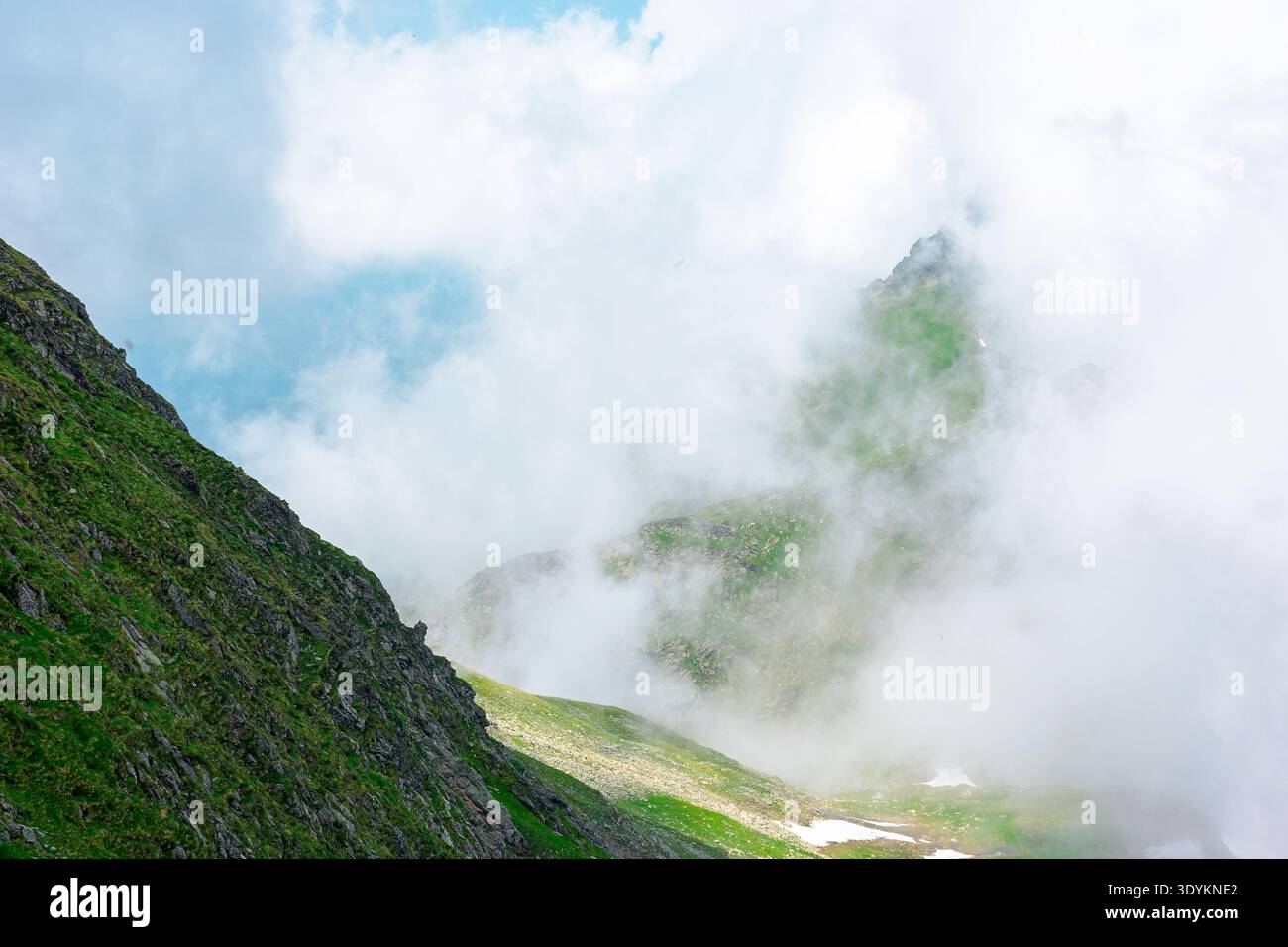 green mountain landscape. photography of carpathian mountain range of romania in summer. atmospheric travel background with realistic cloud scenery ar Stock Photo