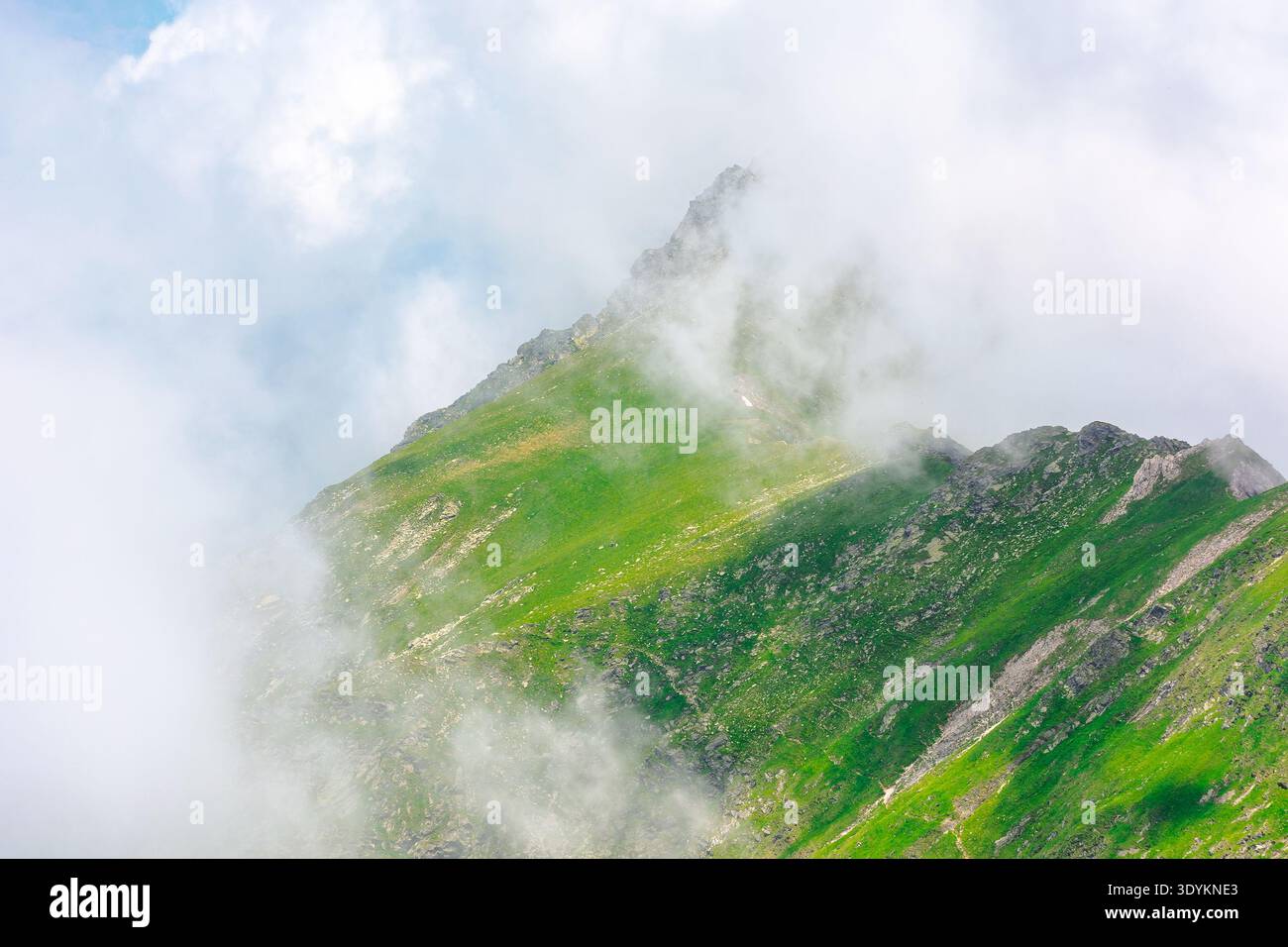 green mountain landscape. photography of carpathian mountain range of romania in summer. atmospheric travel background with realistic cloud scenery ar Stock Photo