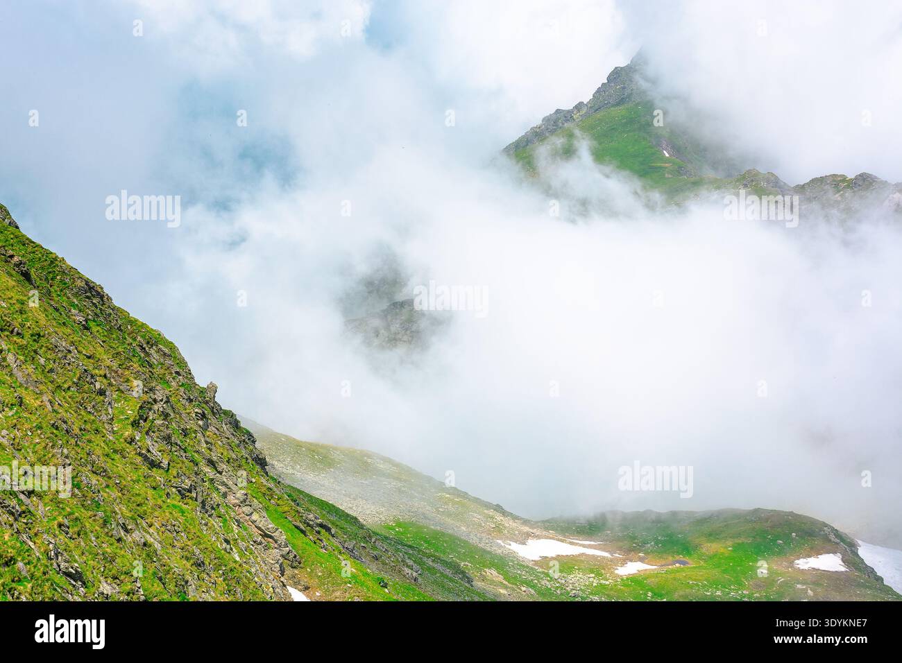 green mountain landscape. photography of carpathian mountain range of romania in summer. atmospheric travel background with realistic cloud scenery ar Stock Photo