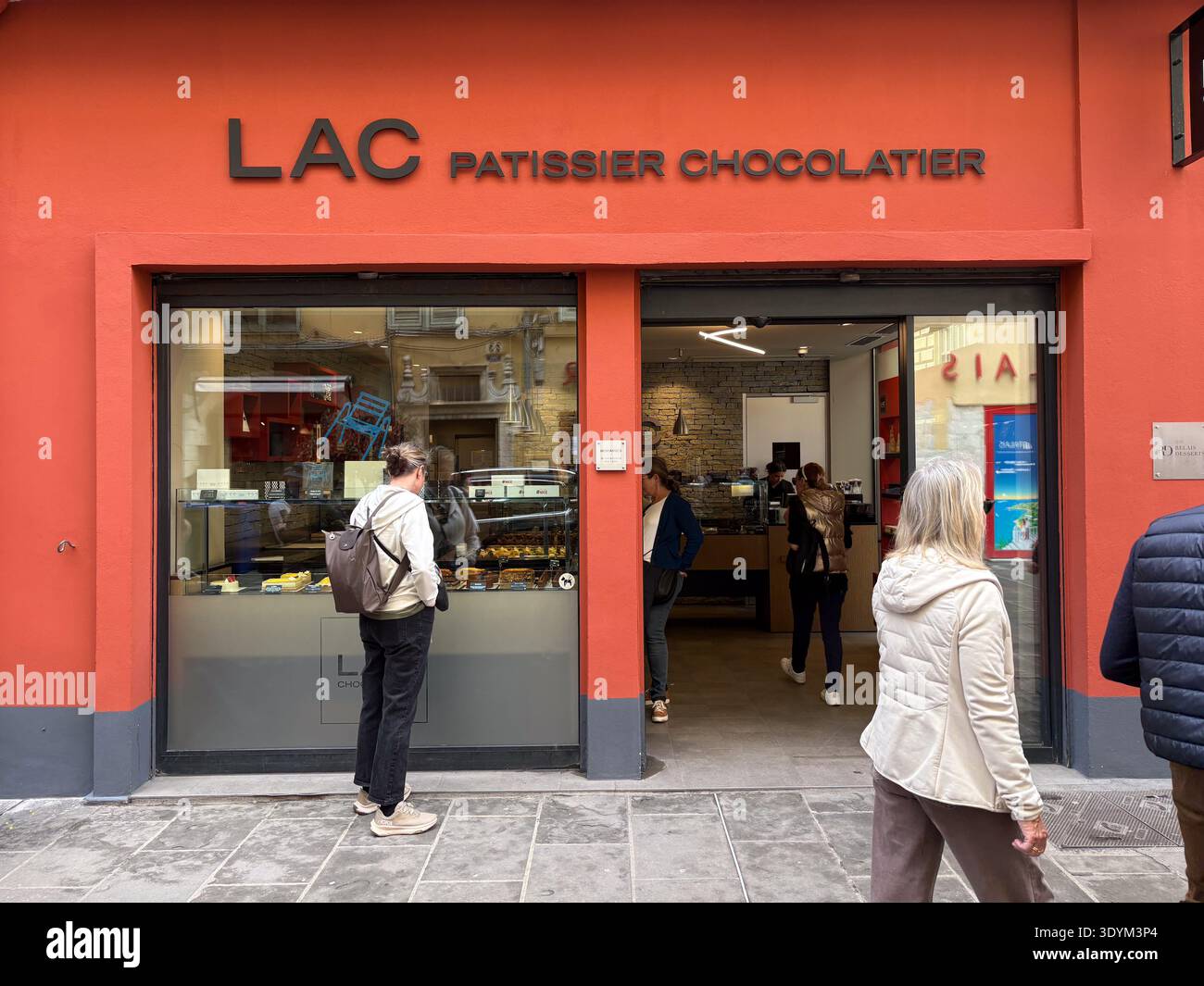 LAC Patissier Chocolatier in Vieux Nice, France. Customers browse