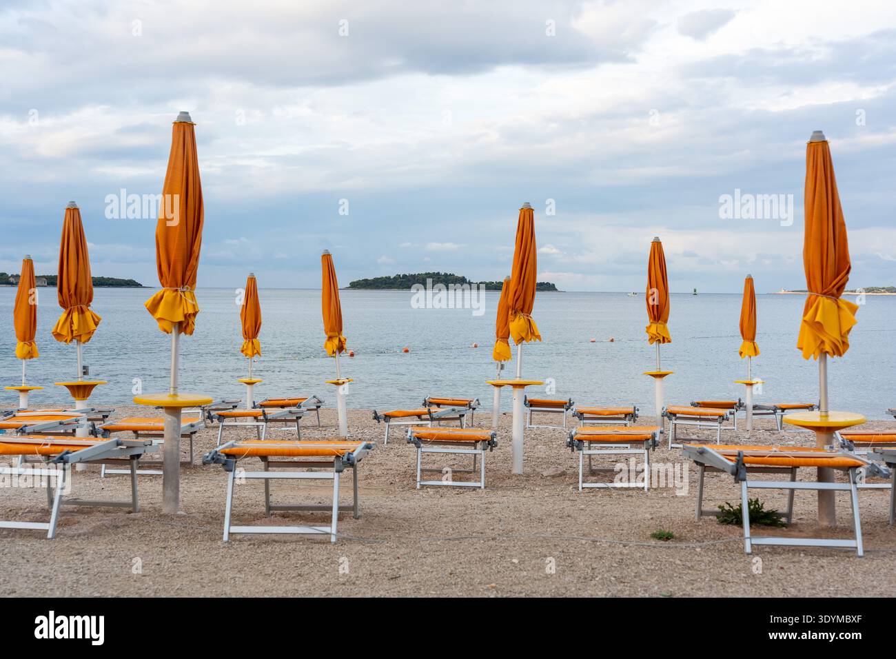 Closed parasols rows blue hi-res stock photography and images - Alamy
