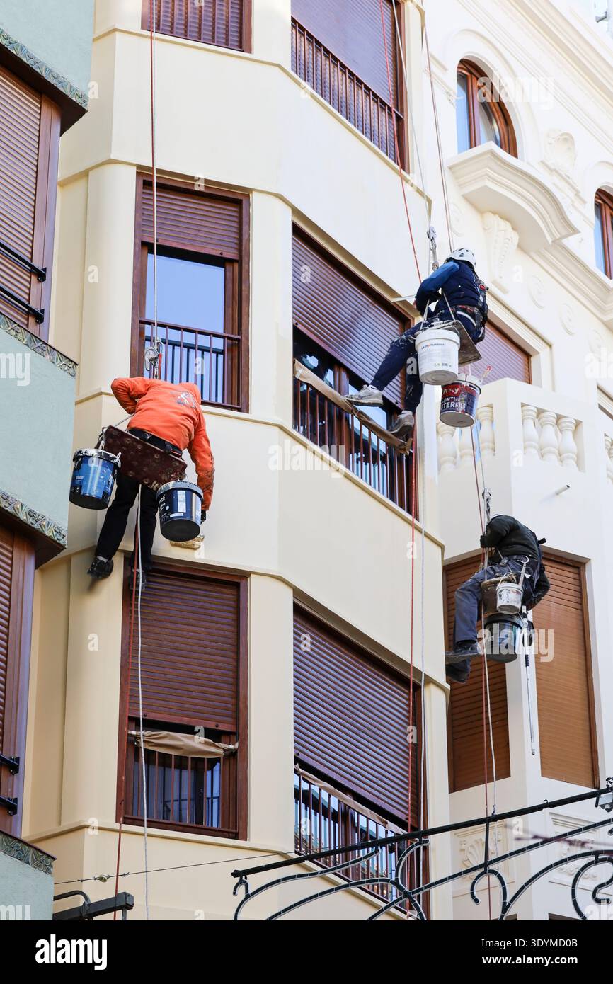 Alicante, Spain- March 3, 2026: Construction workers repairing damaged ...