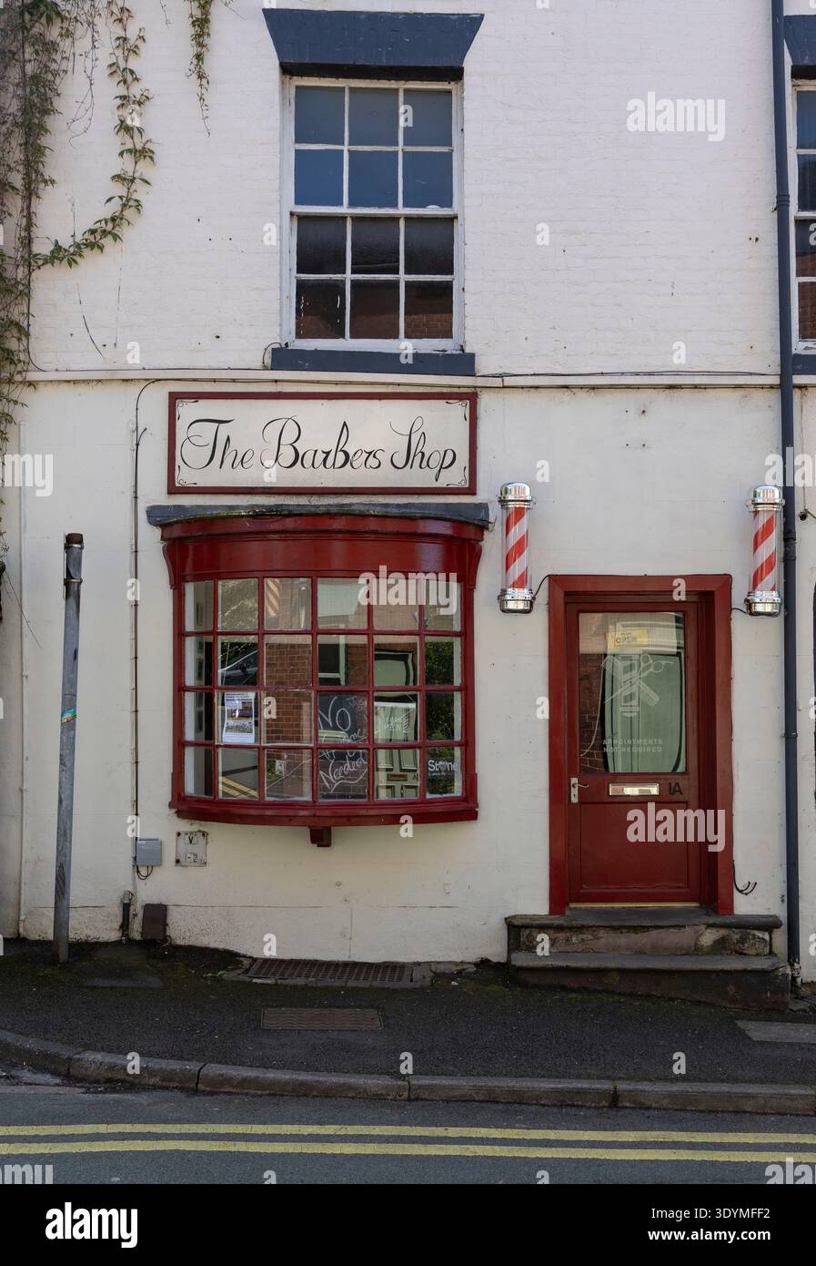 Storefront exterior business facade yellow lettering hi-res stock ...