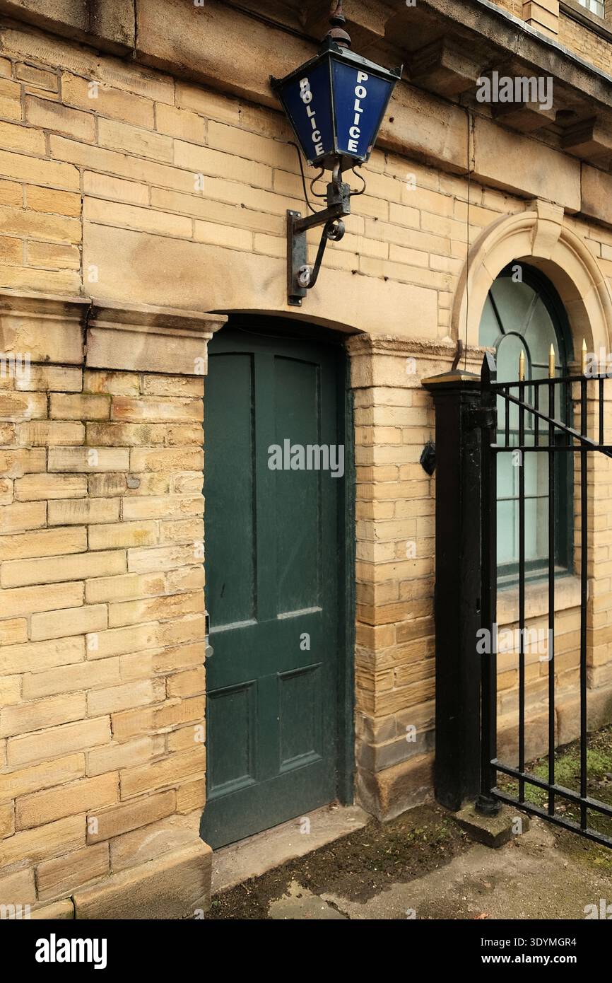 A Victorian Police station with a blue Police light above a green doorway Stock Photo