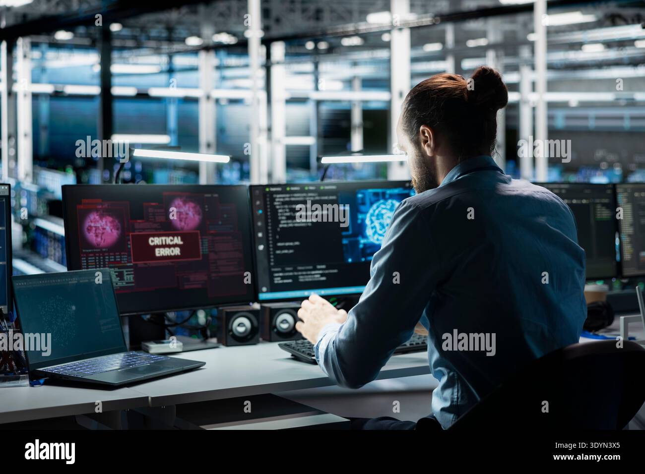 Data center computer scientist trying to fix malfunctions using AI program. Server hub IT professional using machine learning to optimize system health, repairing critical error Stock Photo