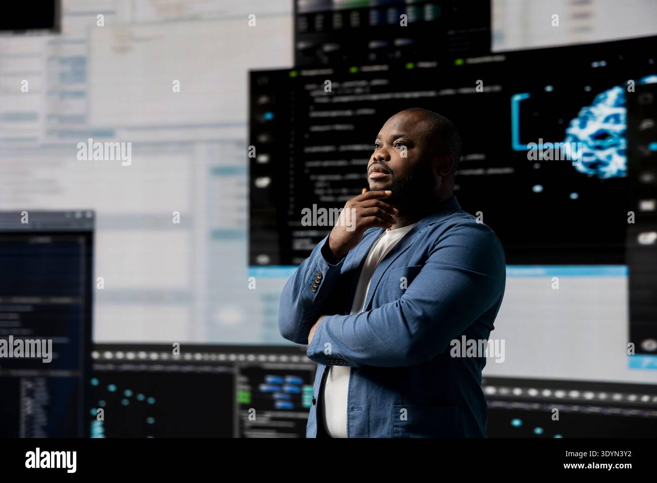 African american software engineer immersed in code development, studying programming language for innovation and data science. Coding life with digital interfaces and terminal window. Stock Photo
