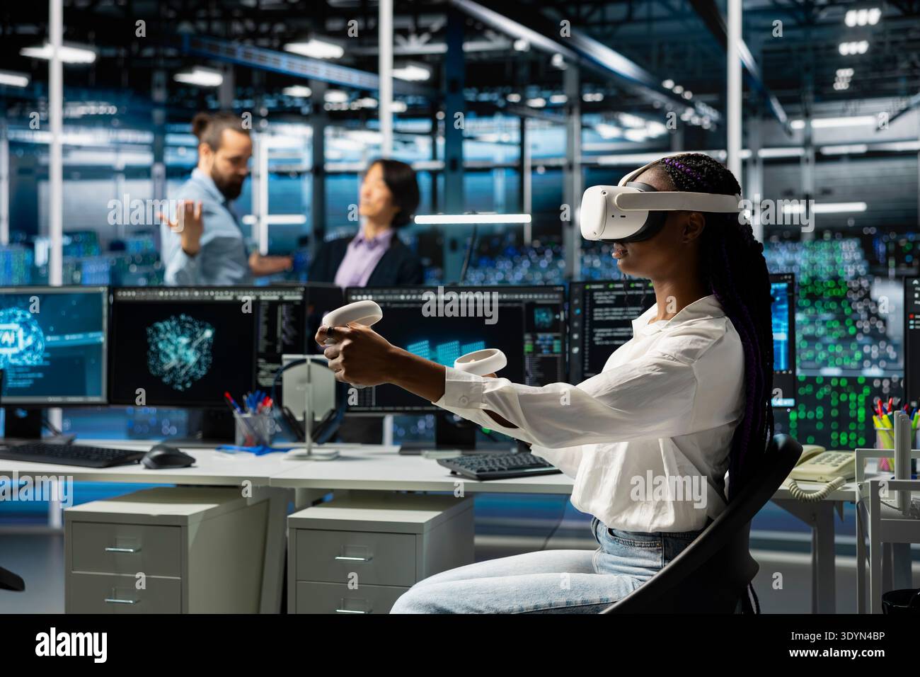 Server farm worker using virtual reality tech, deploying deep learning tools to automate repetitive workflows. Data center technician wearing VR headset managing datasets used in AI training Stock Photo