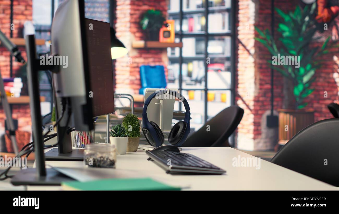 Empty office desk with computer screen showing terminal windows and network neurons. AI powered system uses cognitive computing and pattern recognition for futuristic software solutions. Stock Photo