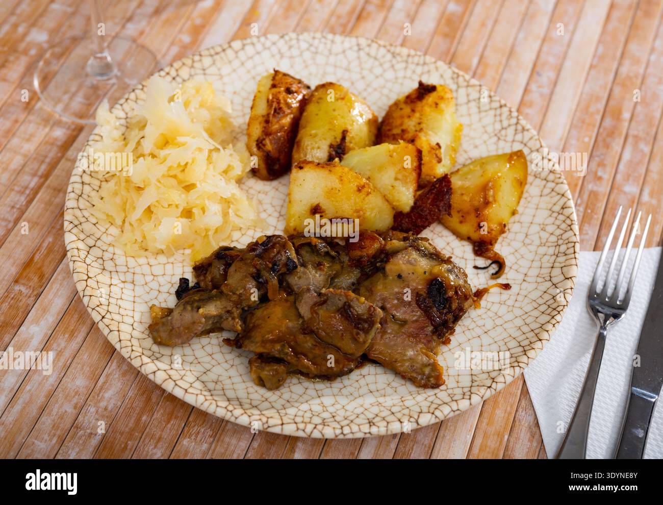 Appetizing fried rabbit liver with vegetables Stock Photo
