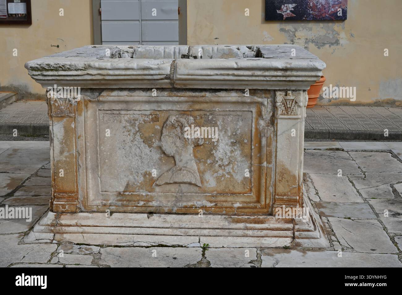 Renaissance marble wellhead in Piombino, Italy. Features bas-relief ...