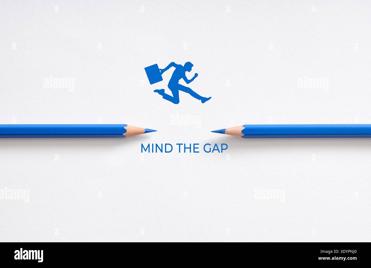 Businessman silhouette jumping over a gap between two blue pencils with ...