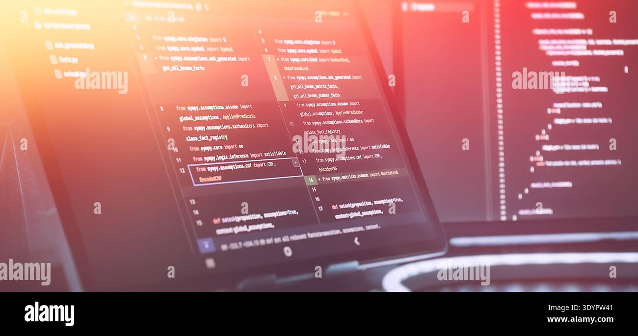 Futuristic Software Coding Workspace with Warm Gradient Light Overlay and Source Code Stock Photo