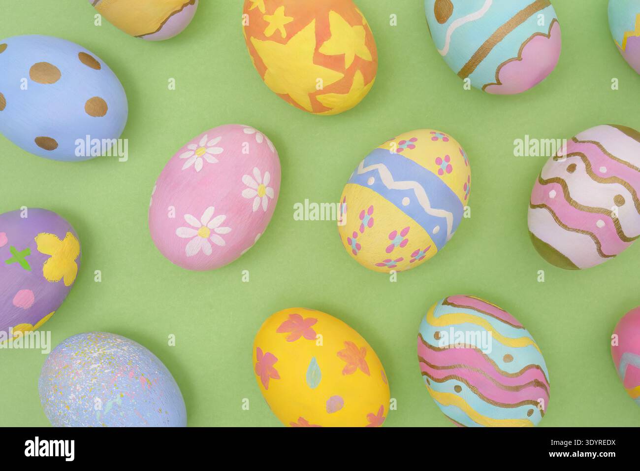 Easter Eggs. Beautifully painted eggs arranged on green background. Stock Photo