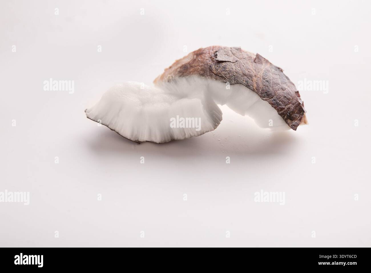 Coconut pieces isolated on a white background Stock Photo