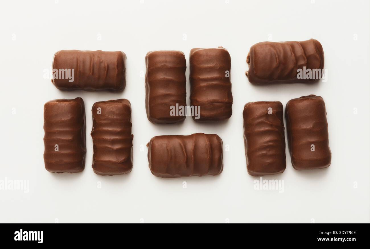 Small chocolate candies isolated on white Stock Photo