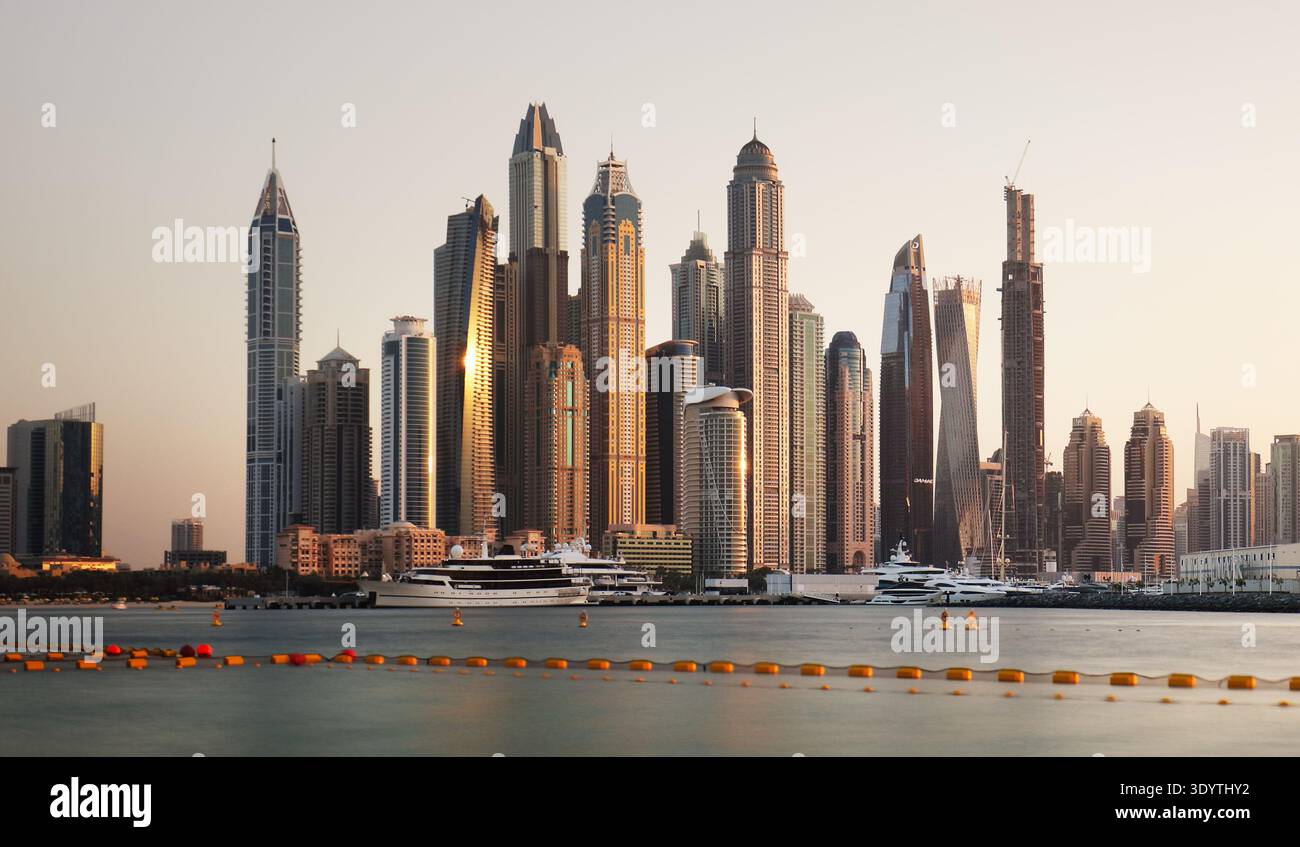 Sunset view of the Dubai Marina and JBR area and golden sand beaches in the Persian Gulf. Holidays and vacations in the UAE Stock Photo